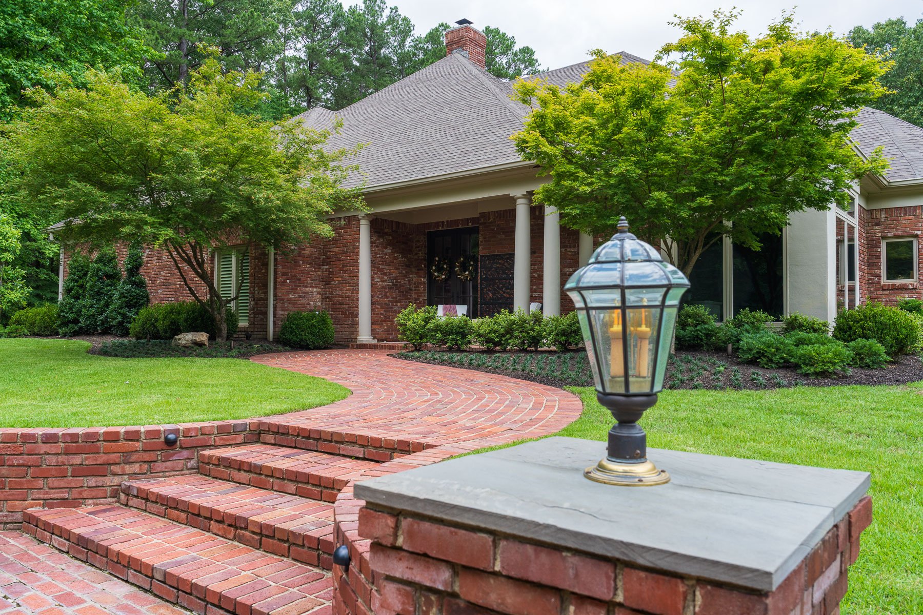 column light brick walk lawn home entry
