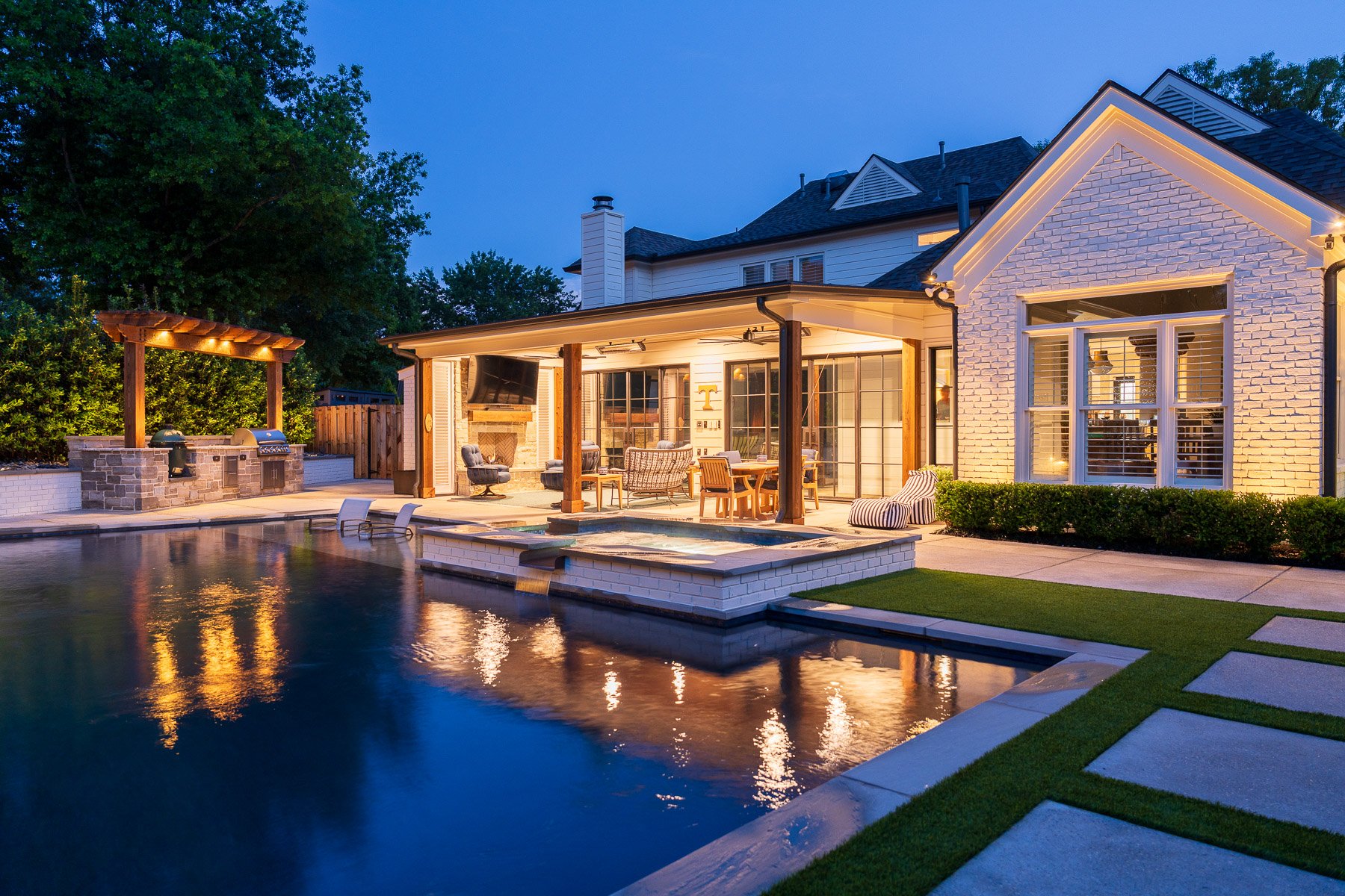 covered patio lighting pergola outdoor kitchen landscape spa pool