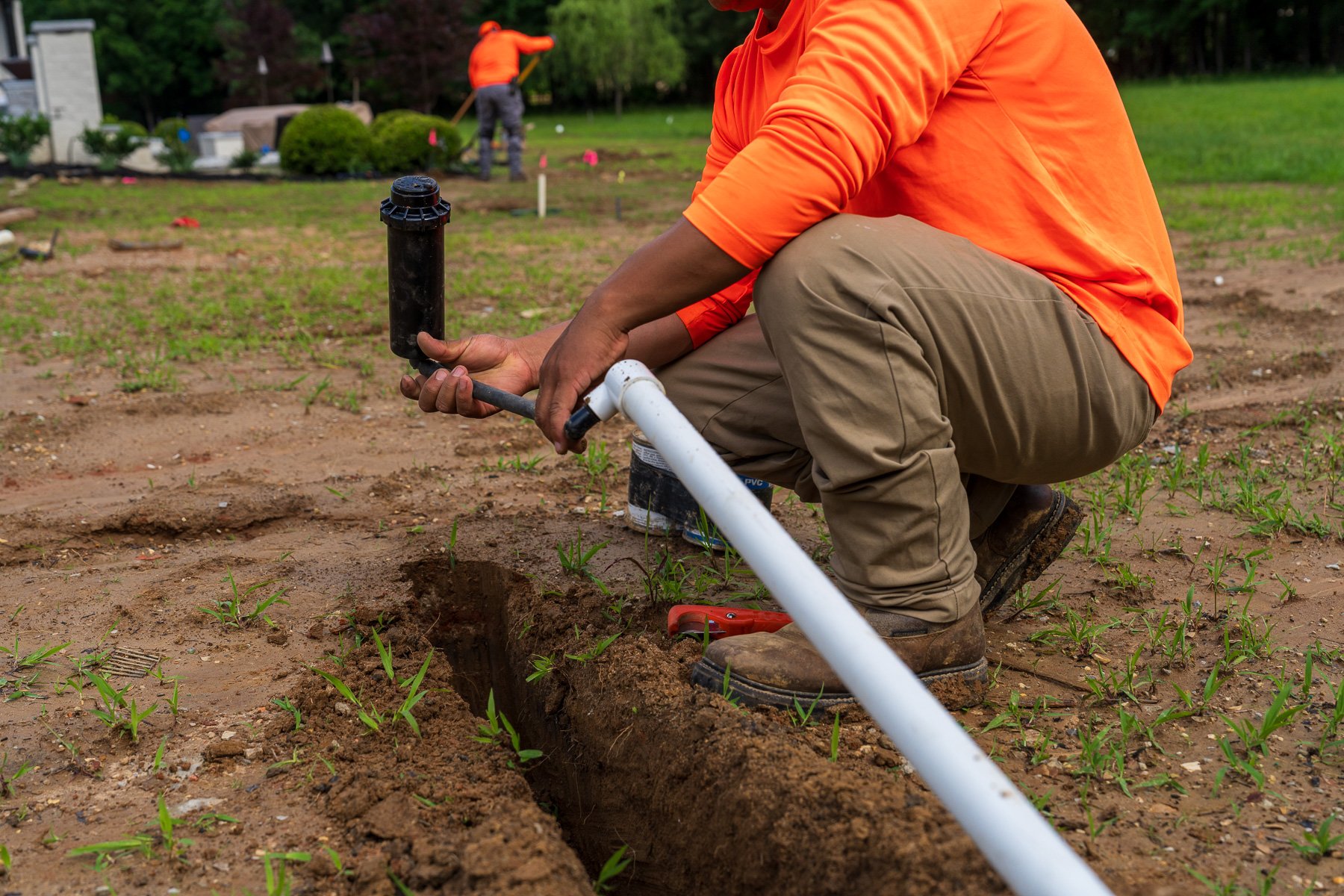 irrigation tech install line pipe pvc sprinkler head 2