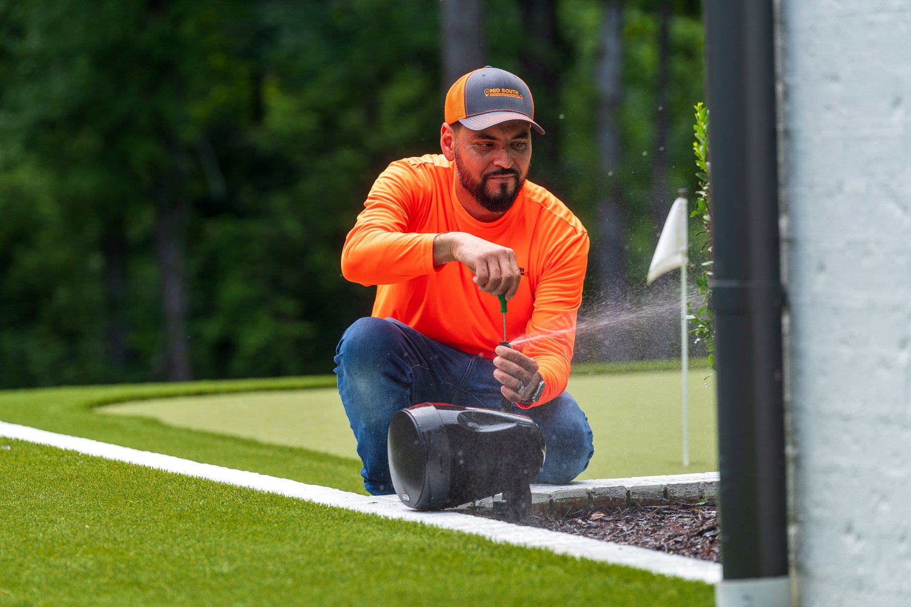 irrigation tech service adjusting sprinkler head audio speakers 4