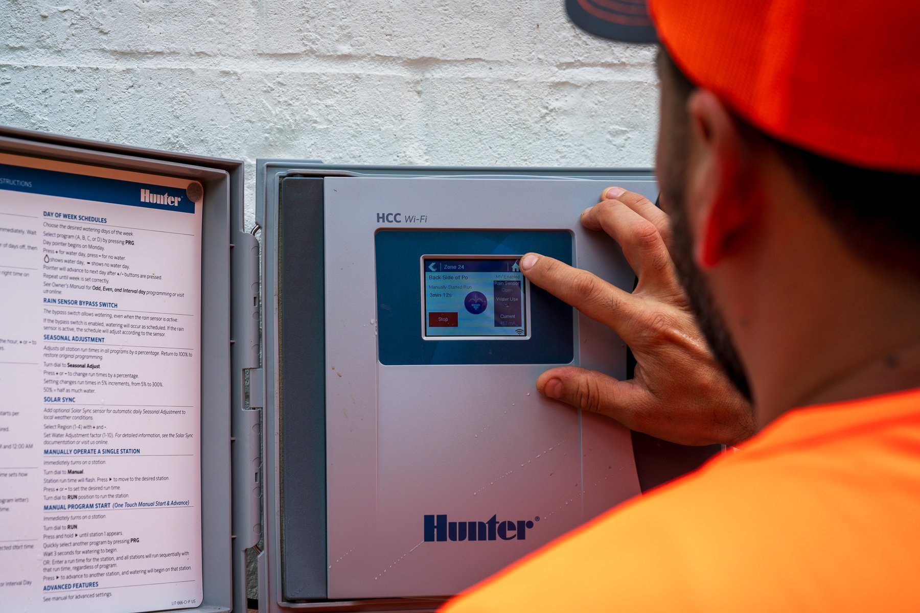irrigation tech service adjusting sprinkler program timing clock controller hunter hcc