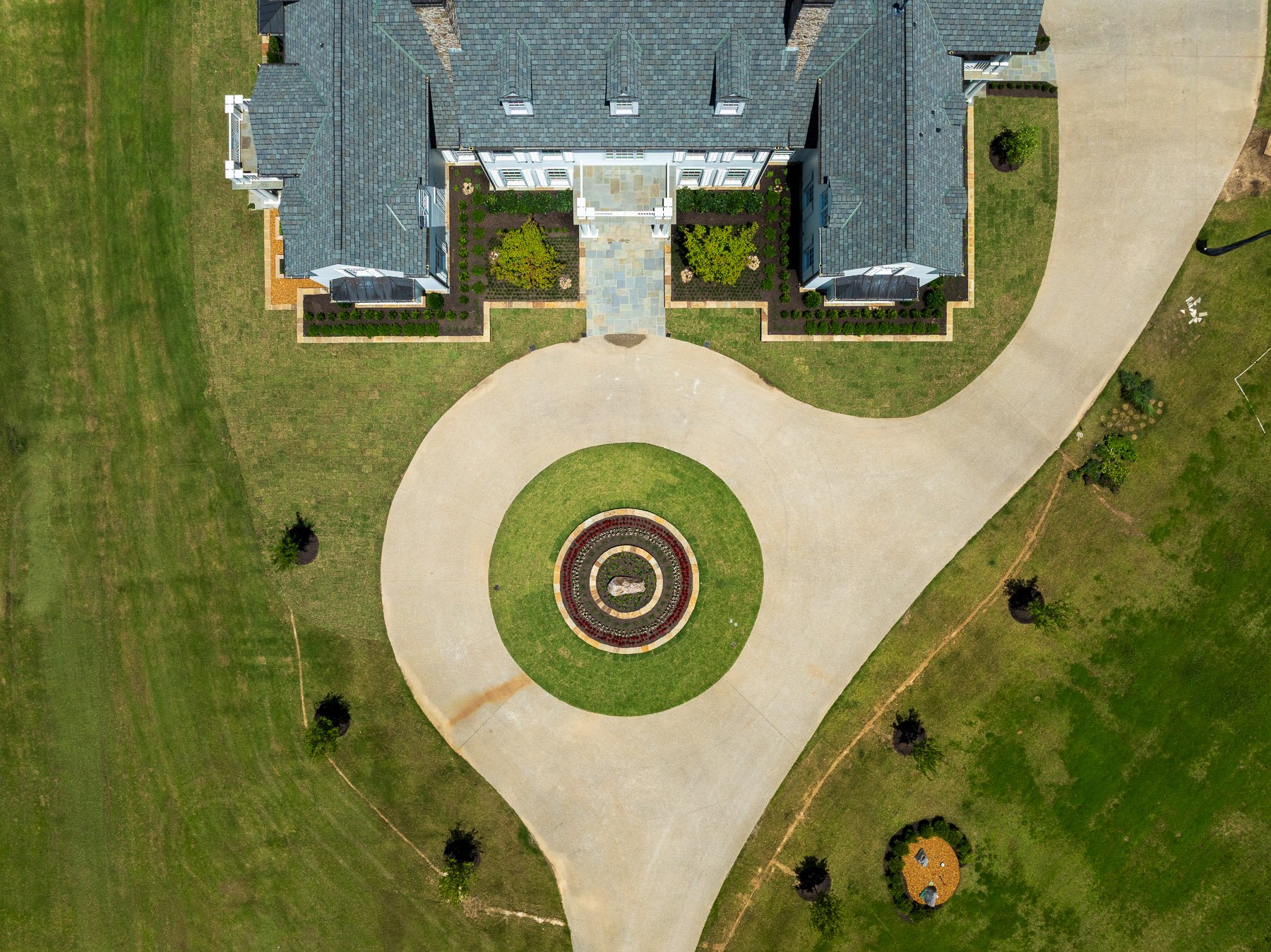 nice aerial truck home landscape flower bed planting green lawn tree rings top down