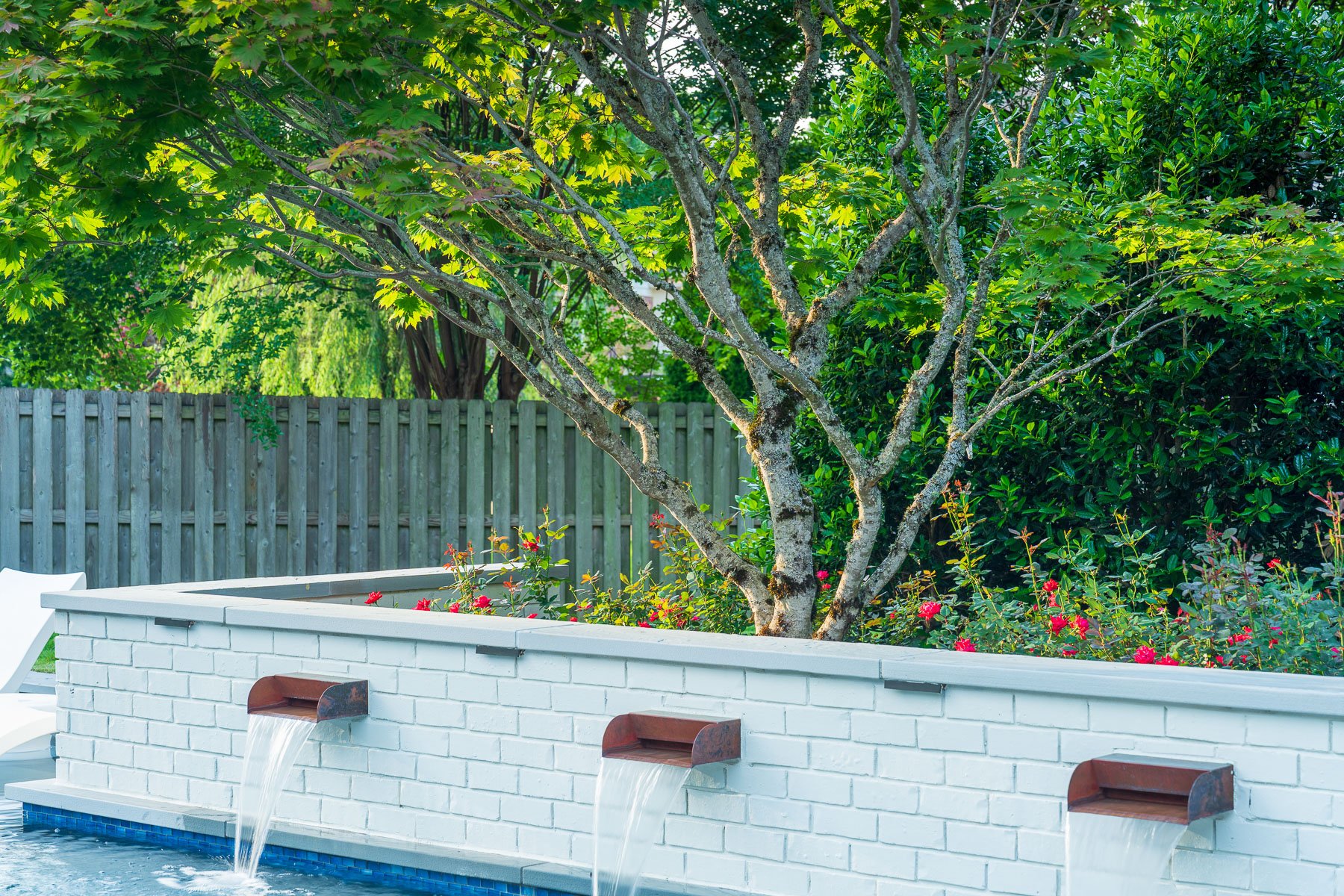 planting bed tree rose bush scupper brick wall lights