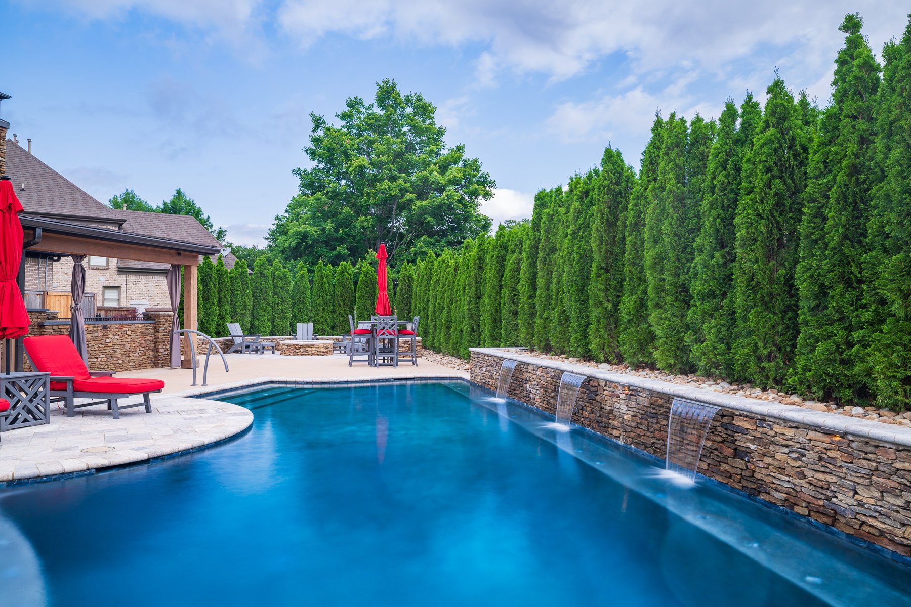 pool scuppers water feature falls seating arborvitae