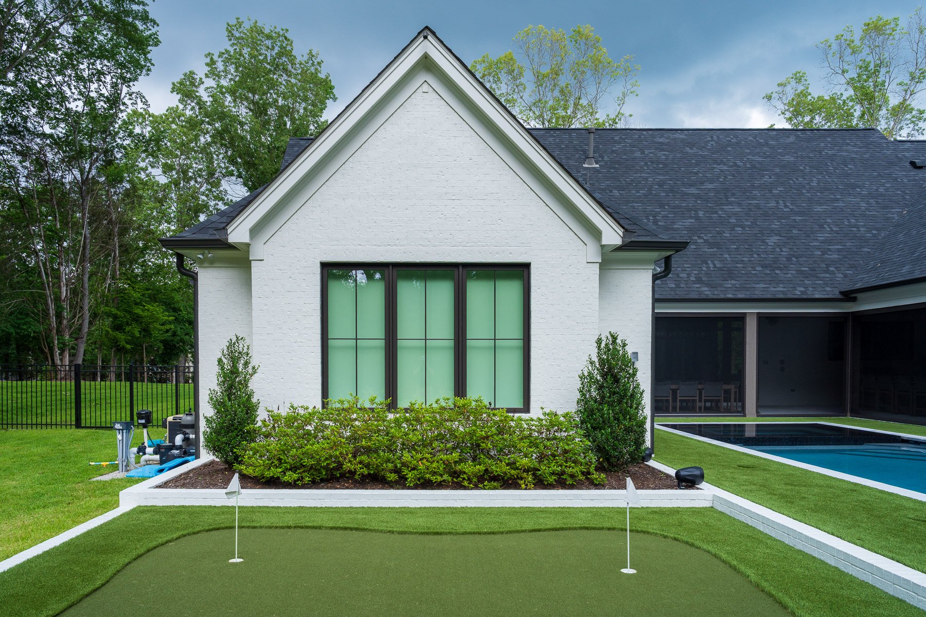 putting green home shrubs planting bed audio speaker artificial synthetic turf