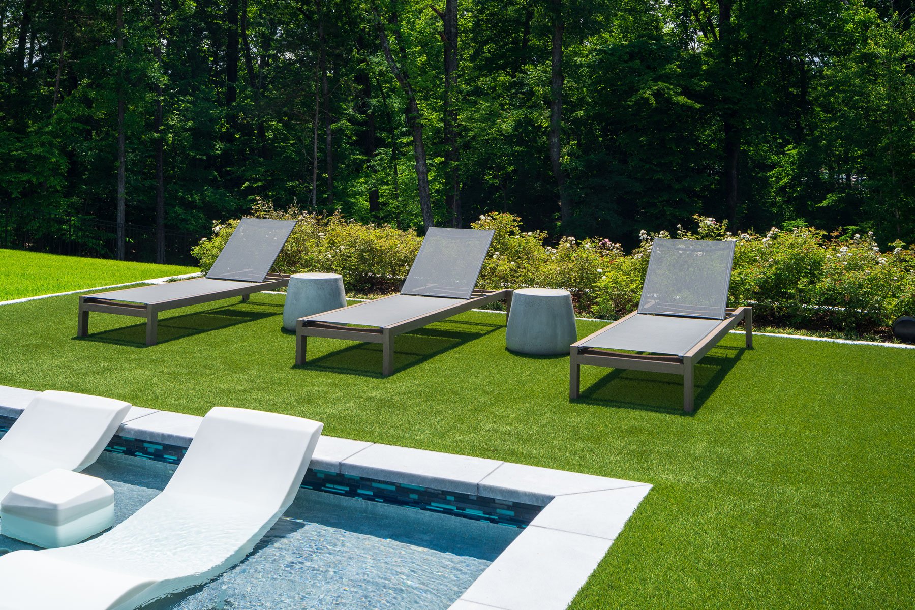 seating artificial synthetic turf pool side landscape