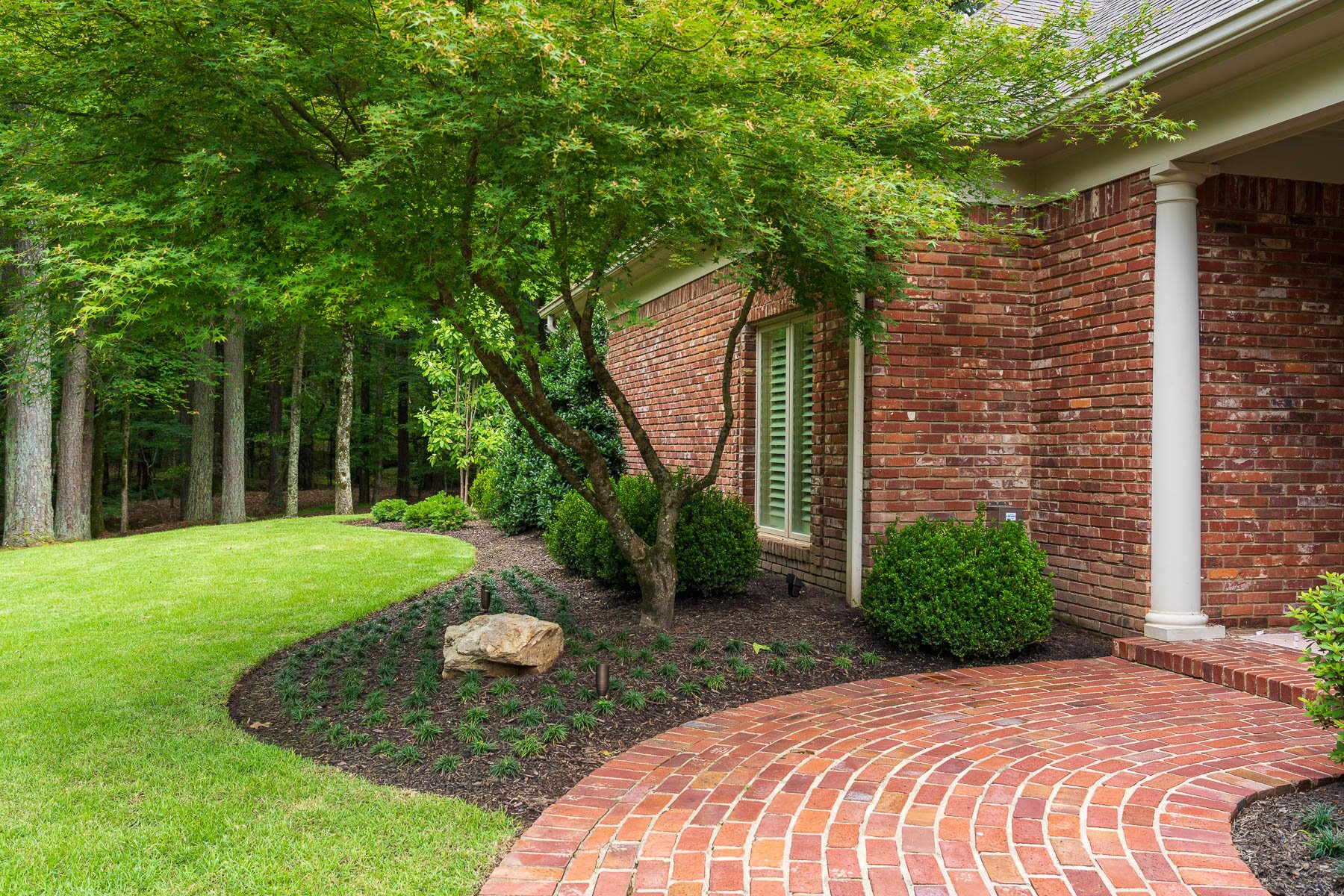 spot uplight planting bed brick home