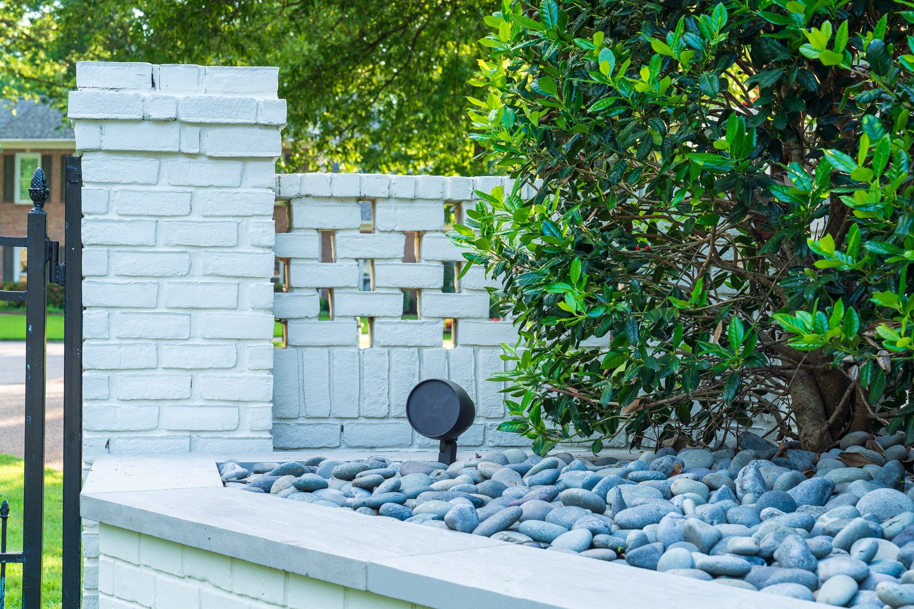 audio speaker mexican beach pebble brick wall column plants