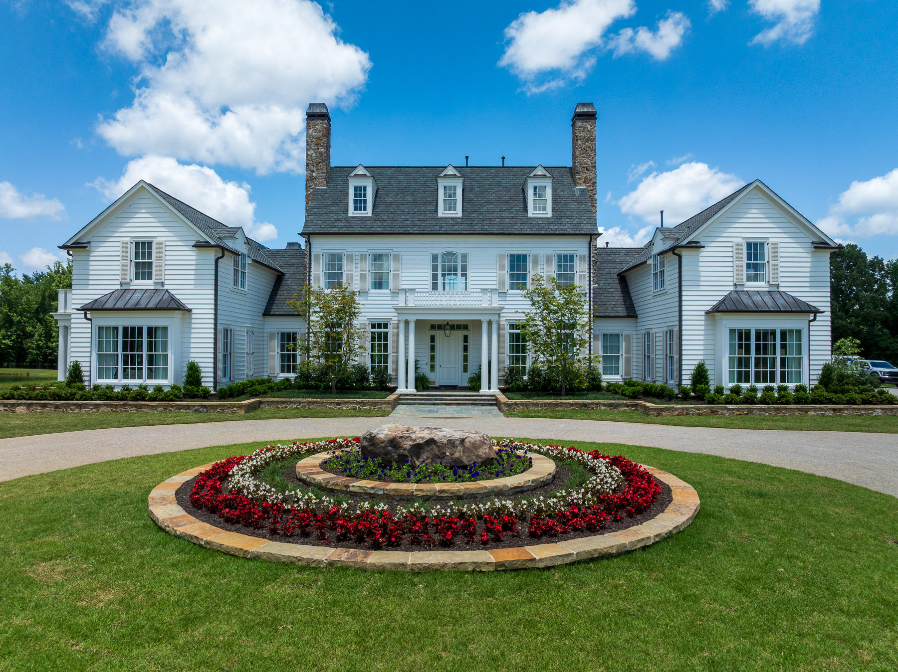 nice home entry flower bed lawn trees planting bed driveway