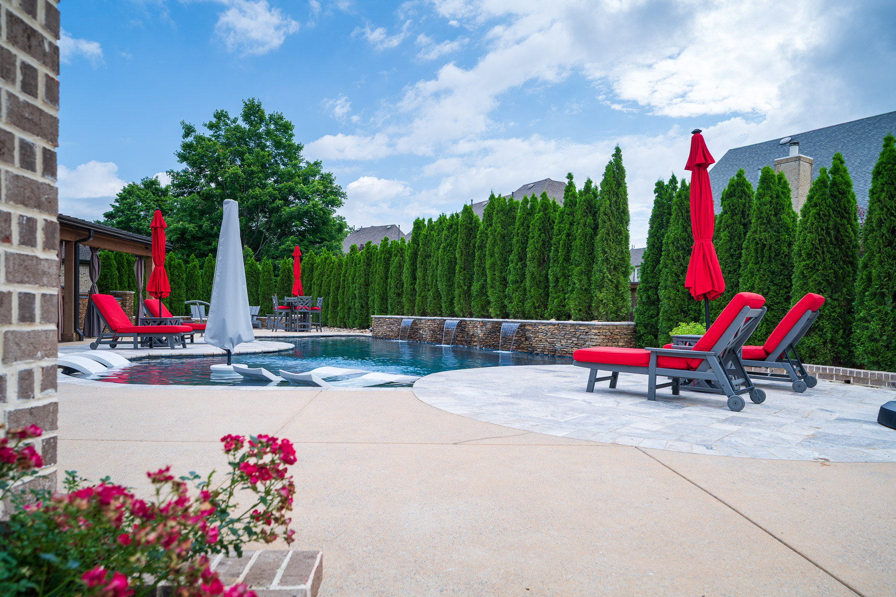 patio pool seating umbrellas scuppers water features wall arborvitae hedge privacy screen